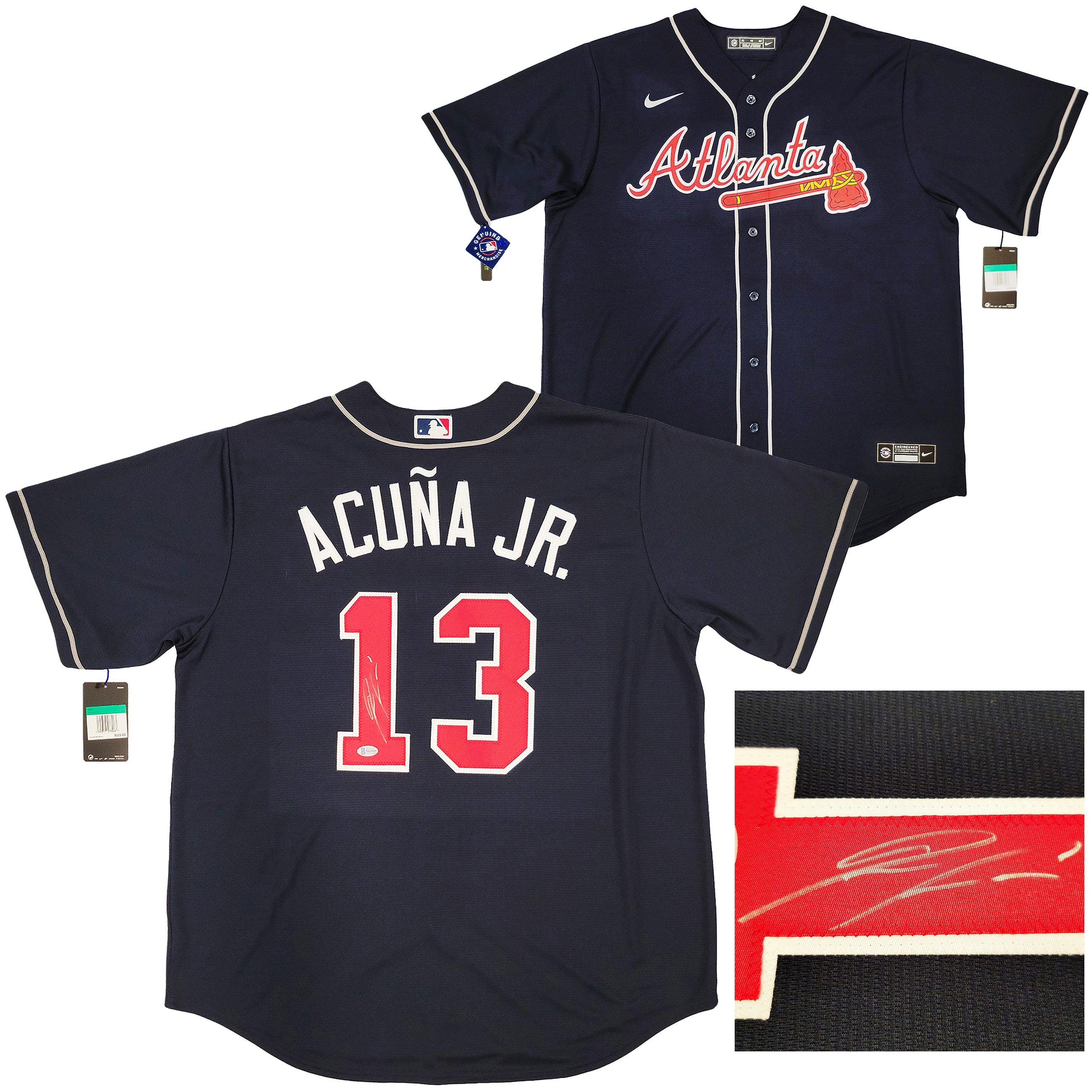 The Nike sliding mitt and batting glove of Ronald Acuna Jr. #13 of
